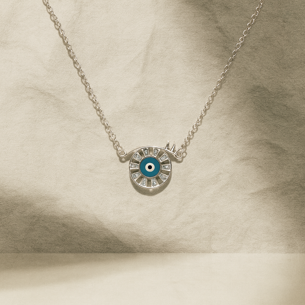 Silver necklace with a blue eye pendant on a beige background